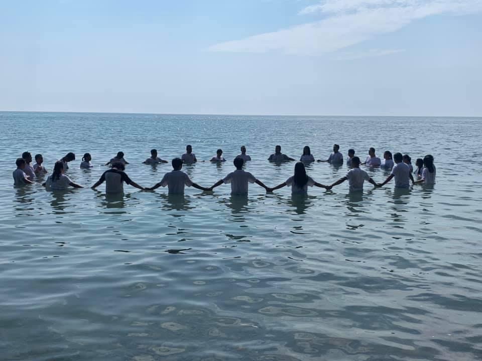 Members of Jesus Christ the Living Bread International celebrate water baptism